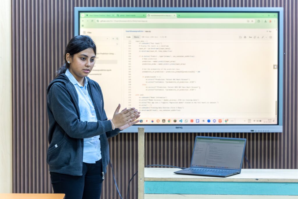 student presenting BCA final-year project in an interview